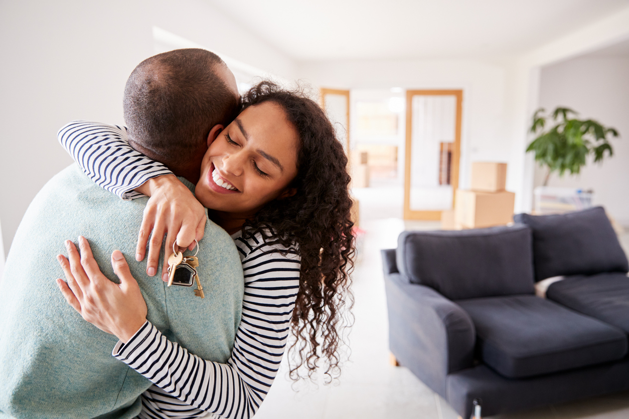 Loving couple moving home